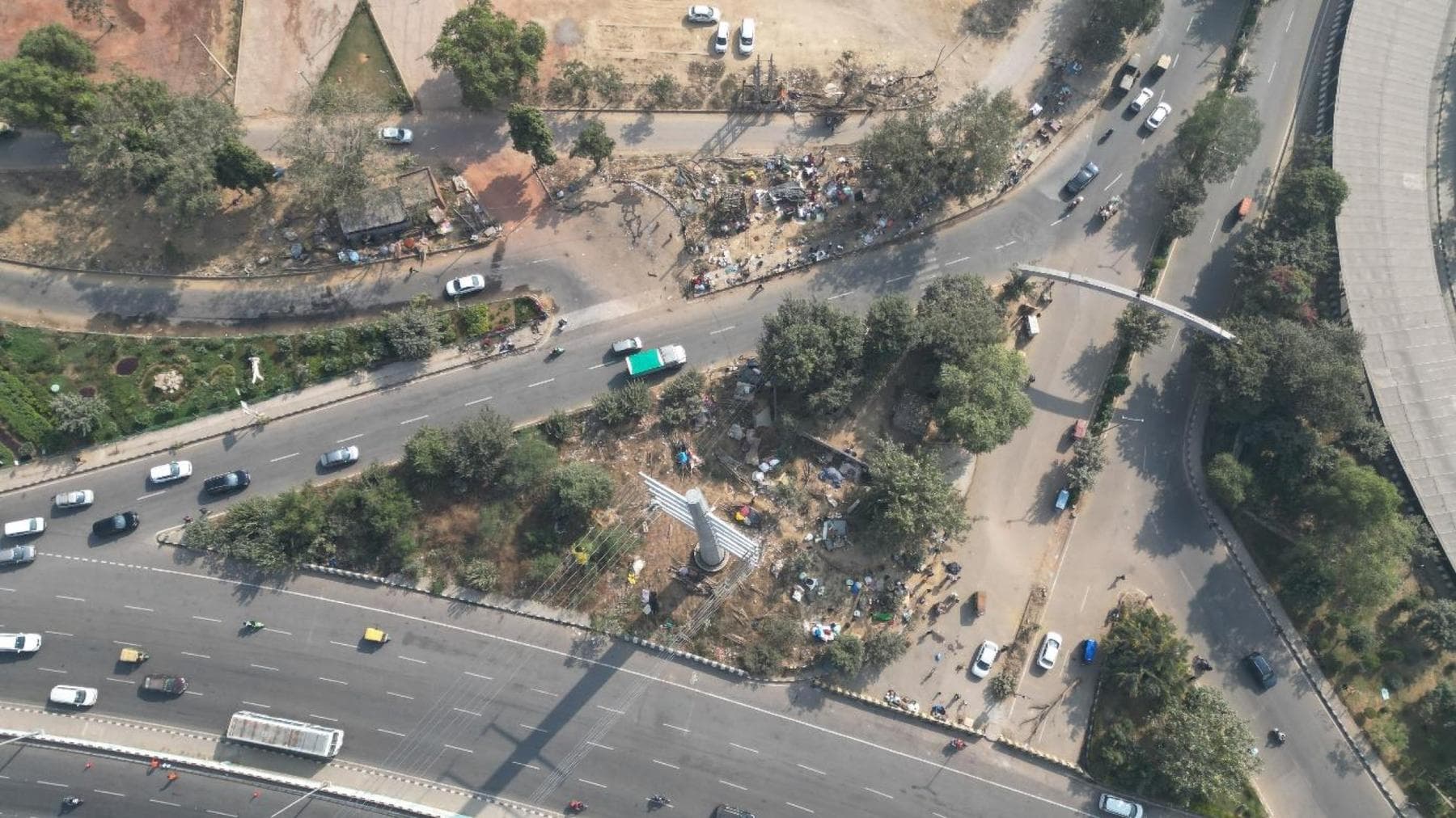 The Rajiv Chowk traffic island before restoration — an aerial view of the garbage-strewn, undulating plot