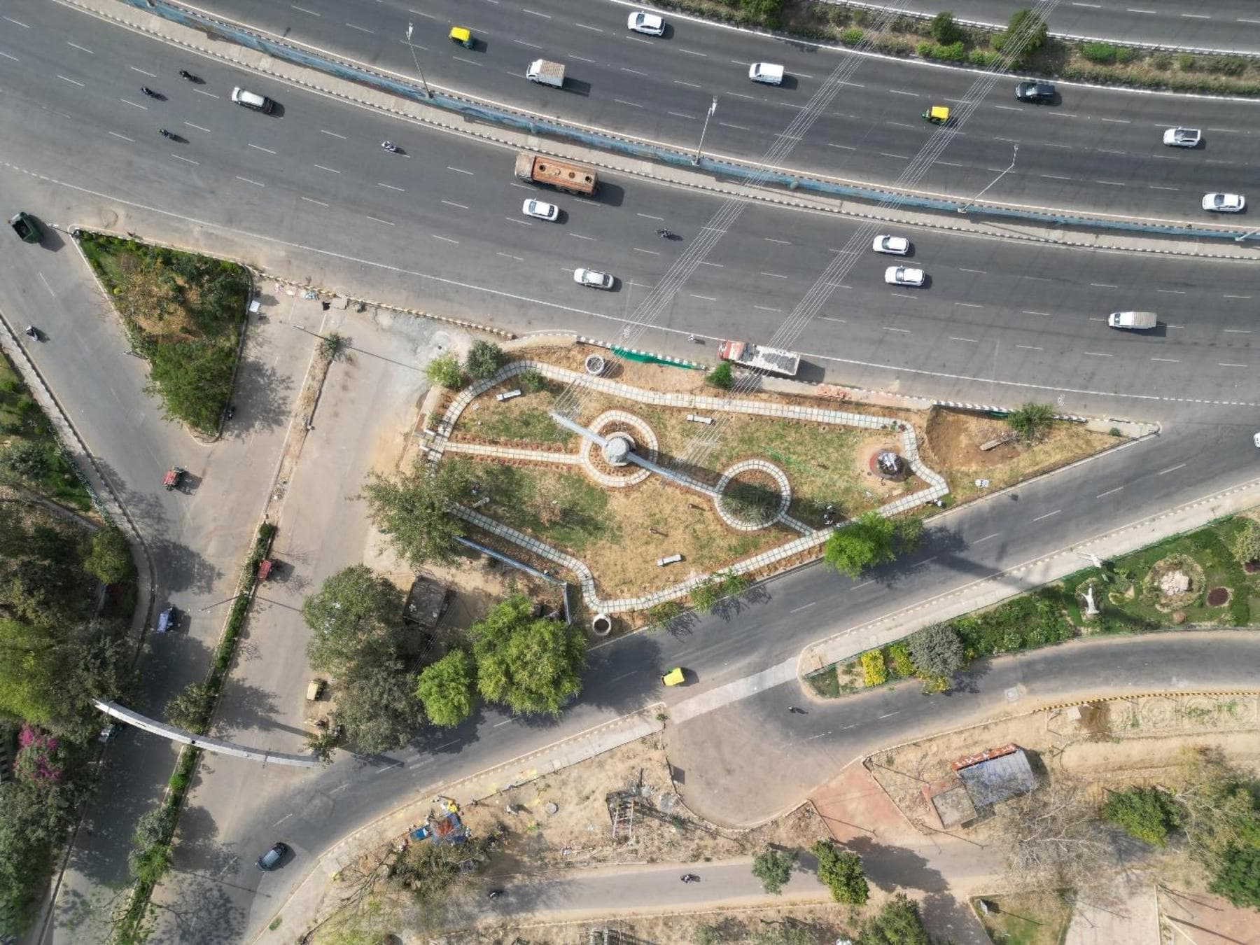 The Rajiv Chowk traffic island after restoration — an aerial view of the landscaped green belt with pathways