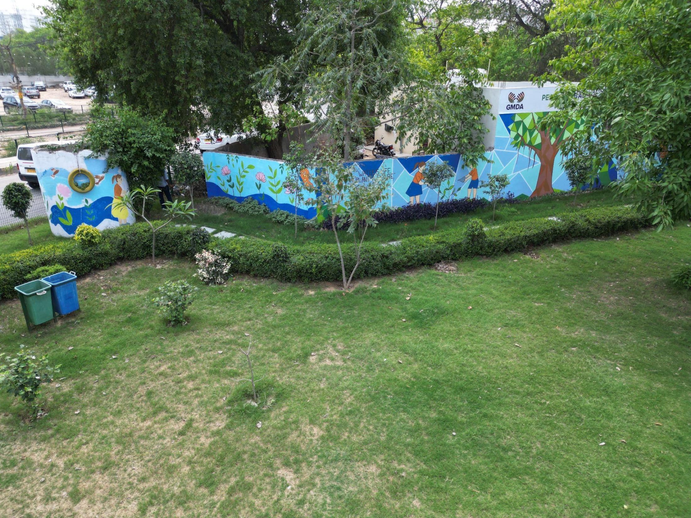 Community mural painted on the boundary wall of the green belt, depicting water conservation themes