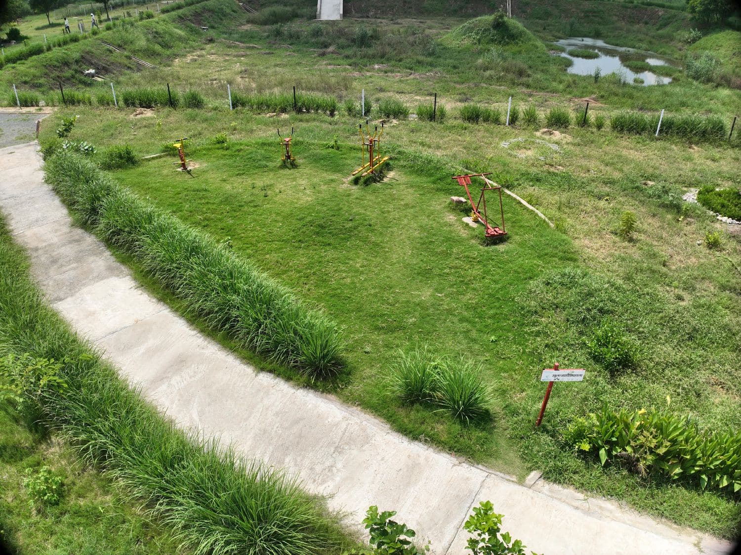 Aerial view of the pond's green buffer zone and looped pathway