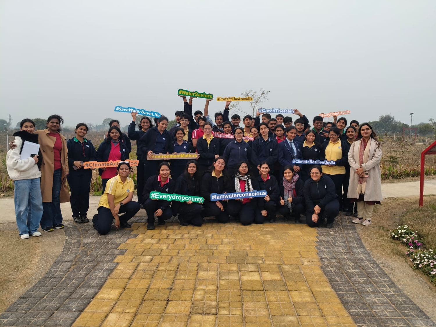 A student group visiting the restored Triveni Pond for a water-awareness session